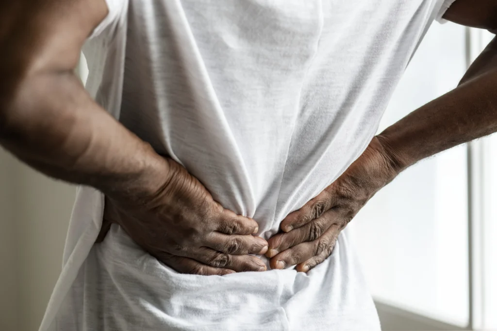 black man suffering back pain