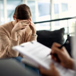 depressed woman having psychotherapy session doctor s office scaled 1