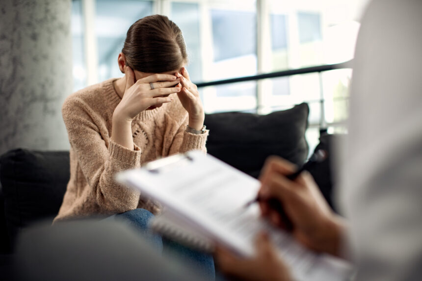 depressed woman having psychotherapy session doctor s office scaled 1