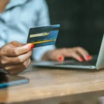 woman paying online with credit card